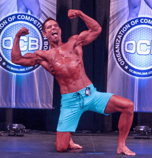 Steve H. posing on an OCB competition stage